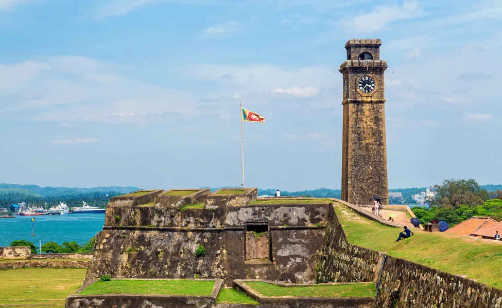 The ramparts and clock tower of Galle Fort above the harbour.